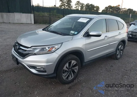 2015 Honda Cr-V Touring z USA, uszkodzony, nr VIN 5J6RM4H95FL109626